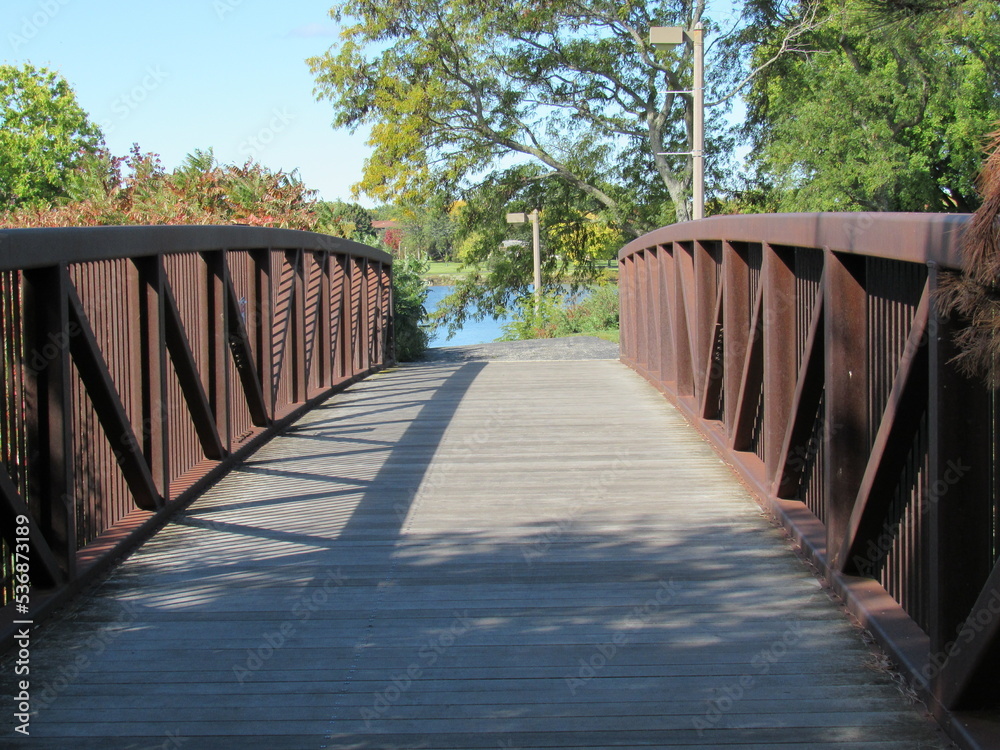 Metal and wooden bridge in the park