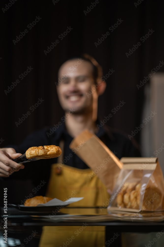 Smiling cafe staff ready to serve bakery Smiling cafe staff ready to serve bakery