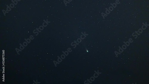 Comet Leonard (C 2021 A1) in dark night sky photo