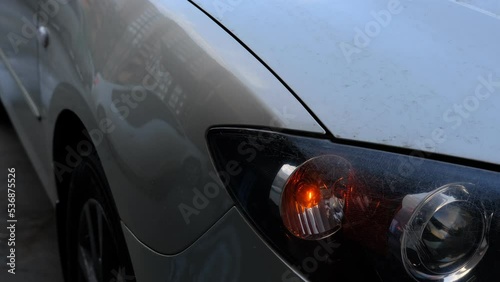 car flashing emergency yellow lights from forward.