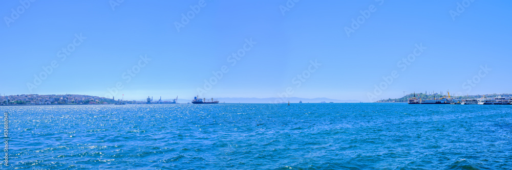 Bosphorus strait with Marine freight ships and vessel on a skyline.