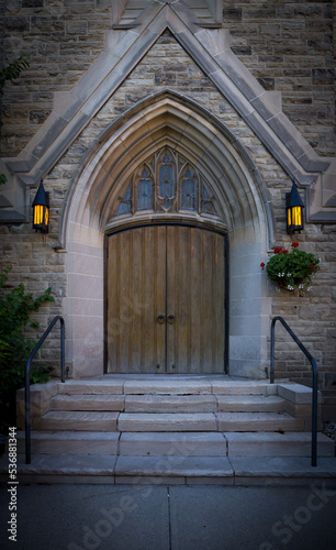 Architectural details - old wooden door with stained glass  entrance to the building with lanterns