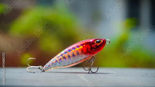 Artificial lure made from plastic for fishing by casting. Selected focus of casting lure with hook - Artificial lure with the shape of minnow