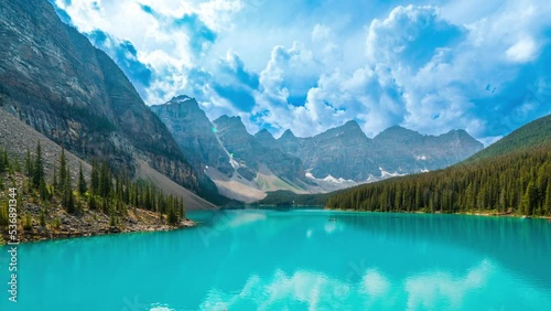 4K time-lapse UHD video of  beautiful view of an iconic famous place, Moraine Lake, a glacier lake located in Banff National Park,Alberta, Canada, in a colorful sunset cloudy summer autumn day.  photo