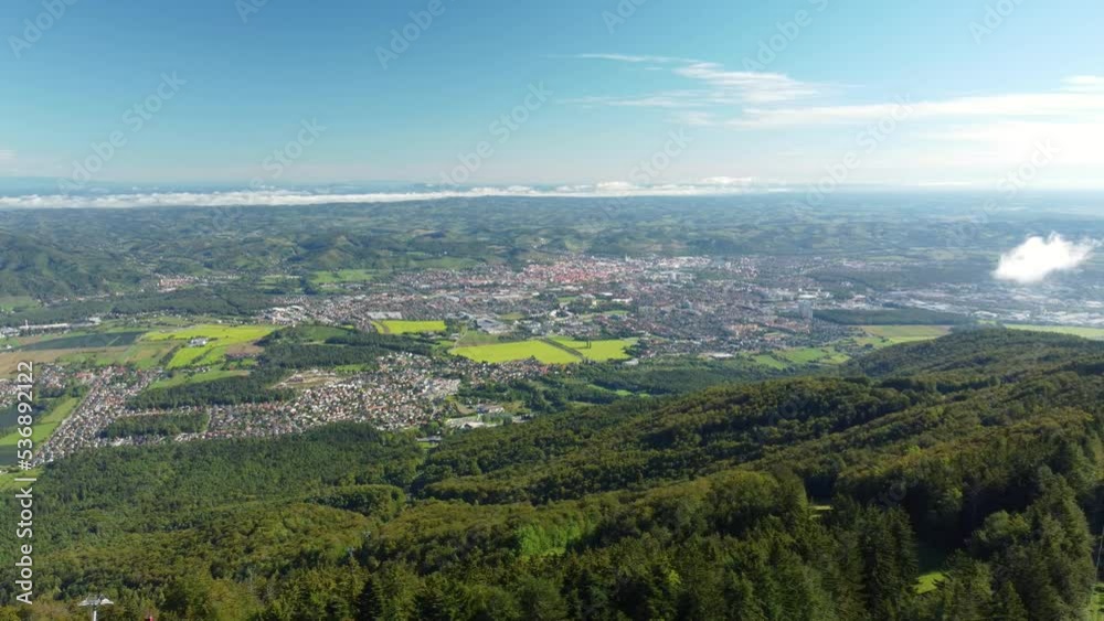 Panoramic view of second-greatest city in Slovenia, Maribor from Pohorje hills, popular hiking destination in summer and skiing in winter, cable cars connection to the city of Maribor, Slovenia Panoramic view of second-greatest city in Slovenia, Maribor from Pohorje hills, popular hiking destination in summer and skiing in winter, cable cars connection to the city of Maribor, Slovenia