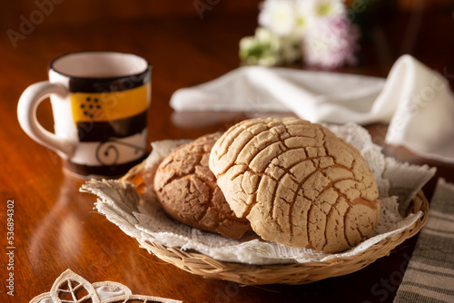 Fototapeta Naklejka Na Ścianę i Meble -  Conchas. Mexican sweet bread roll with seashell-like appearance, Usually eaten with coffee or hot chocolate at breakfast or as an afternoon snack.