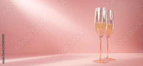 Glasses of champagne in pink studio