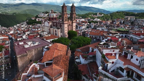 Aerial view towards the Church of Santa Prisca, in Taxco Guerrero, Mexico - approaching, drone shot photo