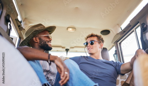 Travel, road trip and men friends in conversation while sitting in caravan on summer holiday. Happy, smile and interracial people relaxing, talking and bonding while on vacation, journey or adventure