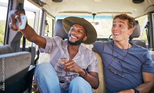 Travel, friends and selfie on a phone by men on a road trip, bonding on a backseat while driving in a vehicle. Freedom, relax and happy black man taking photo with friend on their journey together