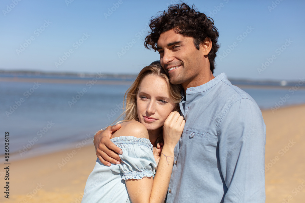 a couple at the beach outdoors
