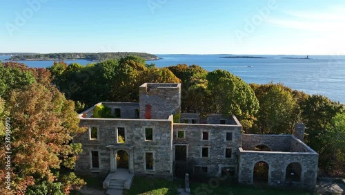 Aerial reveal of Casco Bay and Atlantic Ocean in Port Elizabeth, Portland Maine. Historic fortress at Fort Williams Park. photo