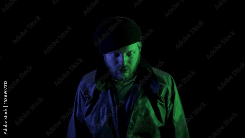Homeless drunk man Under the Influence of Drugs. Psychedelic effect. Narcotic hallucination concept. Depression and hopeless. Face of a person in overdose. Glowing colourful light of rainbow. Rave