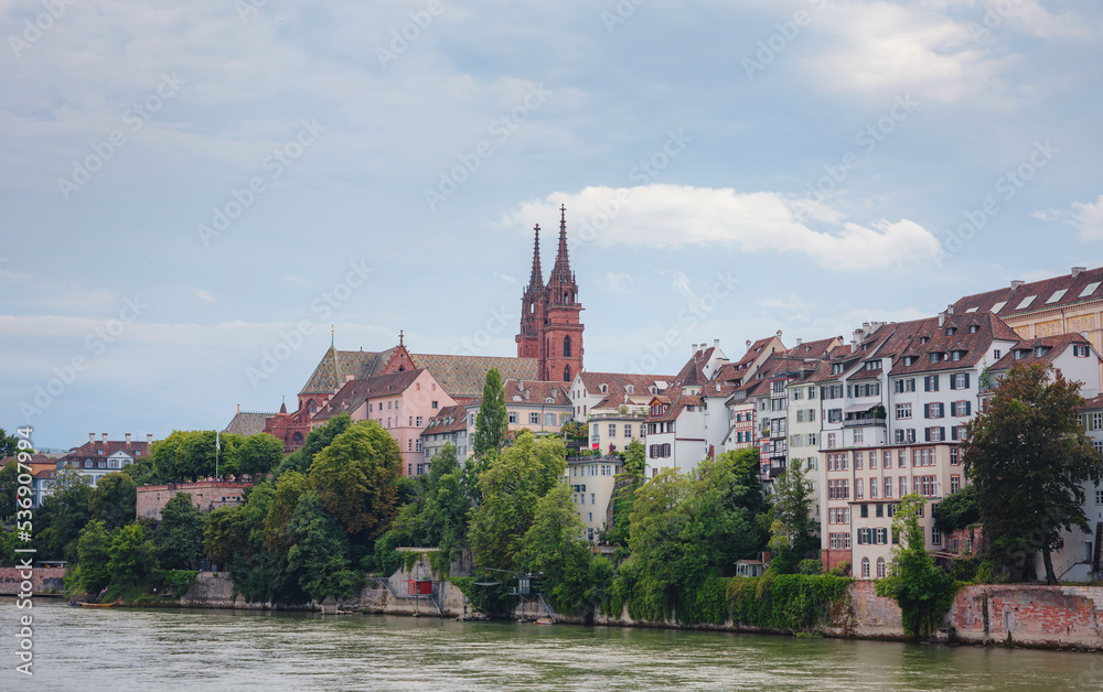 Buildings in the city centre of Basel and the Rhine river, Switzerland. Riverside of swiss city with Basel Cathedral