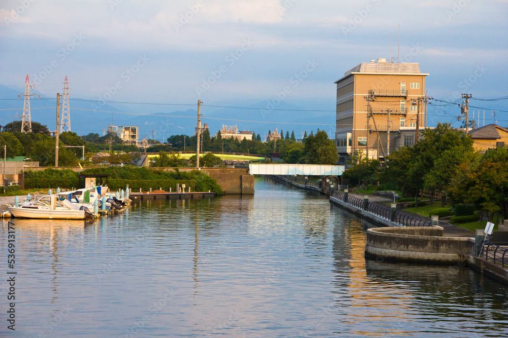 Scenery of Iwase canal and Toyama townscape at sunset.