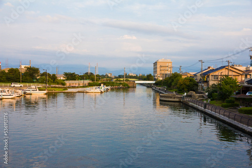 Scenery of Iwase canal and Toyama townscape at sunset.