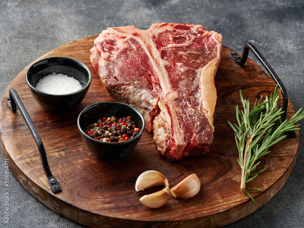Tbone or porterhouse raw steak of beef cut from the short loin. Steak