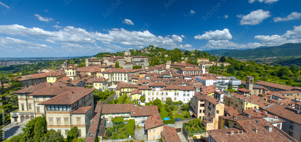 Panoramic aerial view of Bergamo Alta from city bell tower on a summer day, Italy