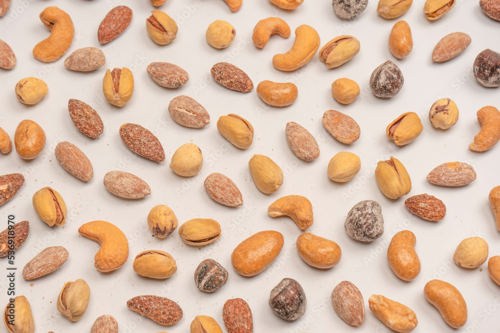 A group of almonds, pistachios, walnuts, macadamia, cashews. A group of almonds, pistachios, walnuts, macadamia, cashews.