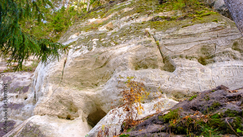 The large sandstone cliffs of Sietiniezis on the banks of the Gauja River in Latvia. tourist nature trail for hiking with wooden stairs. Gauja National Park in the vicinity of Valmiera, Autumn, 