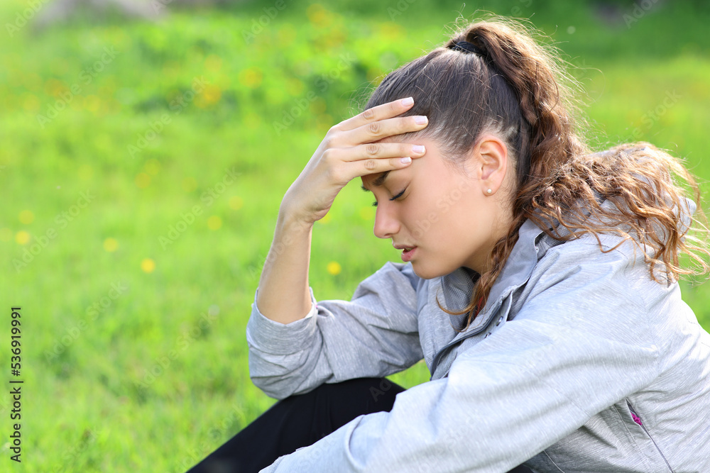 Hiker suffering head ache in the mountain Hiker suffering head ache in the mountain