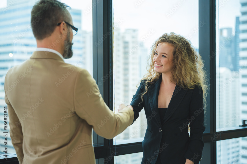successful negotiate and meeting handshake concept, businessman partner person shake hand with to celebration partnership and teamwork to success business deal agreements contract