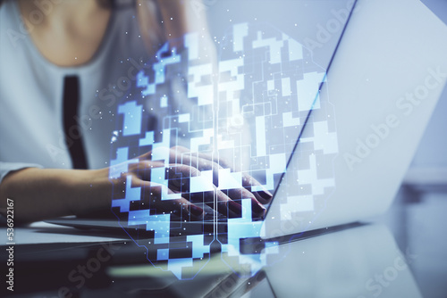 Multi exposure of woman hands working on computer and data theme hologram drawing. Tech concept.