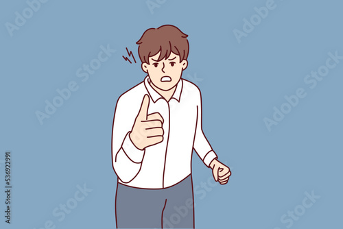Angry man point at screen accuse or blame someone. Furious guy threaten to person feel outraged and distressed. Vector illustration. 