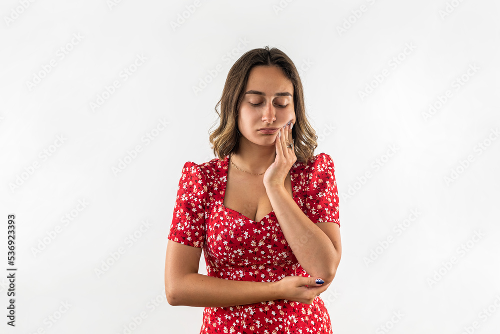 Portrait of a woman experiencing a painful toothache.