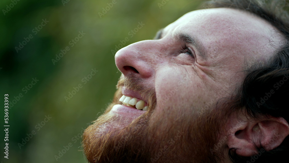 Grateful man closing eyes in meditation. Person opening eye to sky with HOPE and FAITH. Spiritual person smiling in contemplation Grateful man closing eyes in meditation. Person opening eye to sky with HOPE and FAITH. Spiritual person smiling in contemplation