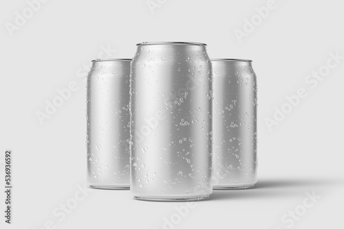 Three aluminium drink can 330ml with water drops mockup template, isolated on light grey background. High resolution. photo