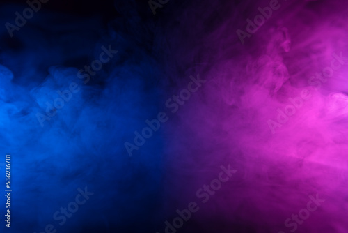 Colorful smoke clouds in blue and pink neon light swirling on empty scene background with reflection