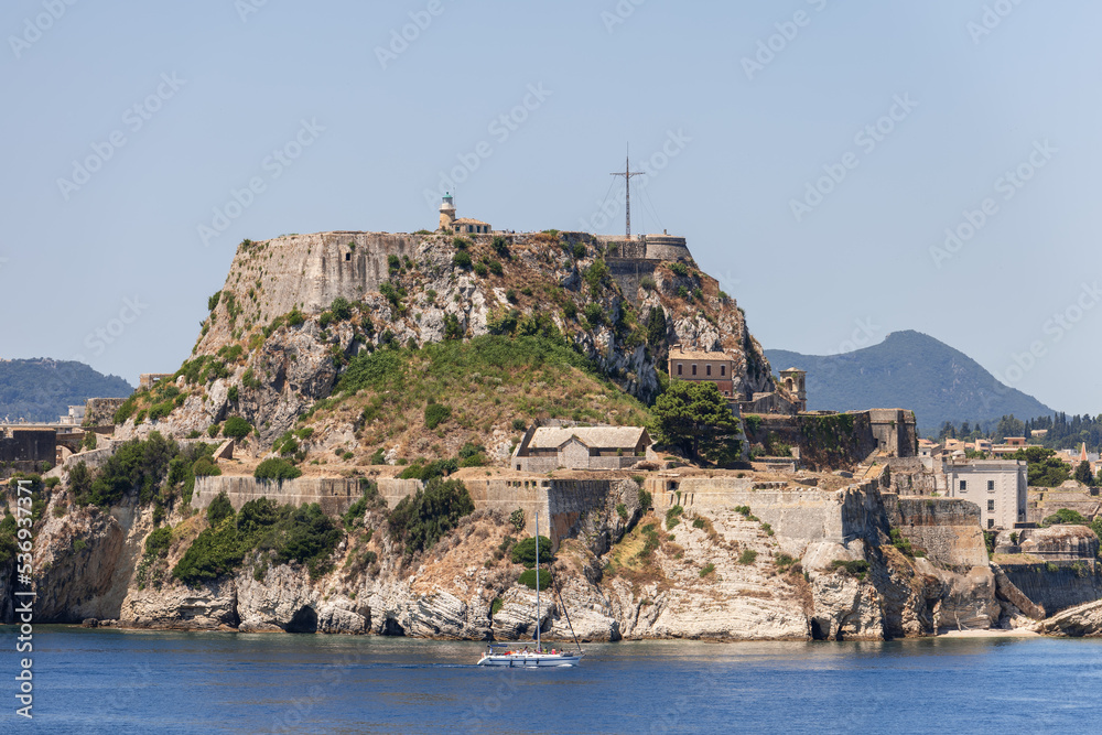 Historic Old Fortress has preserved bastions, remains of old prison, military hospital and a church with red watchtower, Corfu island, Greece, summer bright morning