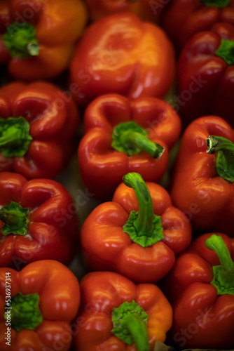 Red pepper with green pod. Healthy vegetables on market. Delicious food.