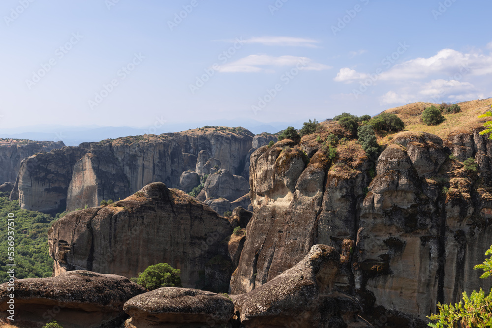 The structure on the face of the monoliths in this image is evidence of water-borne sediment being deposited in sequences. Meteora, Central Greece