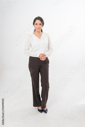 Studio portrait photo of a young beautiful elegant Brazilian female businesswoman lady wearing smart casual business attire posing with a series moments of emotion and gesture for all application