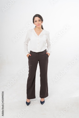 Studio portrait photo of a young beautiful elegant Brazilian female businesswoman lady wearing smart casual business attire posing with a series moments of emotion and gesture for all application