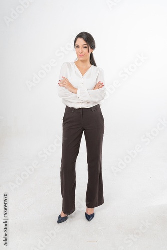 Studio portrait photo of a young beautiful elegant Brazilian female businesswoman lady wearing smart casual business attire posing with a series moments of emotion and gesture for all application