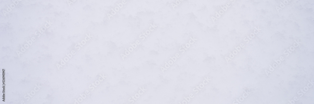 winter background texture fresh snow covering ground. natural abstract pattern flat rough coating snow surface. icy frozen snowflakes on light calm drifts closeup. nature and christmas time. banner