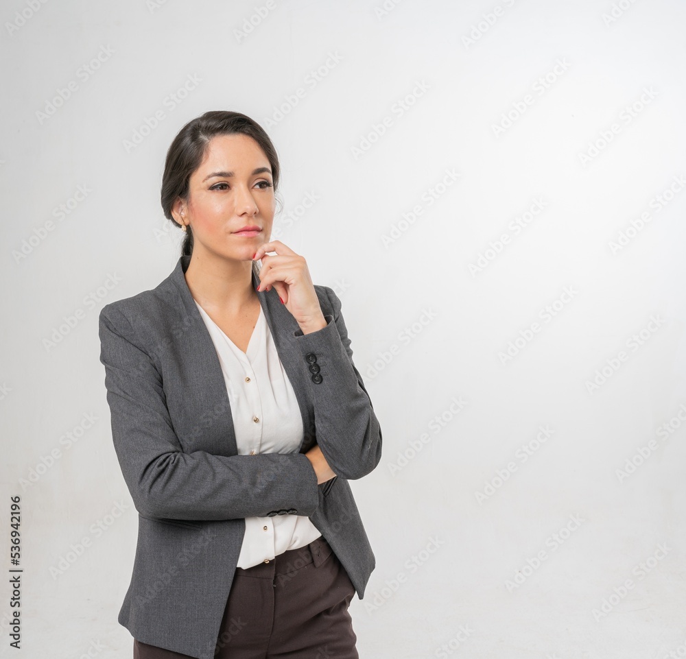 Studio portrait photo of a young beautiful elegant Brazilian female businesswoman lady wearing smart casual business attire suit posing with a series moments of emotion and gesture for all application Studio portrait photo of a young beautiful elegant Brazilian female businesswoman lady wearing smart casual business attire suit posing with a series moments of emotion and gesture for all application