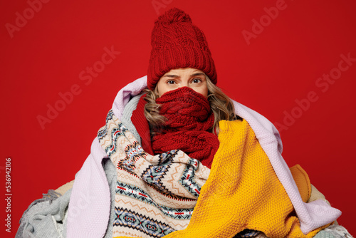 Vászonkép Young frozen woman wear cover mouth with scarf hat wrapped in many plaids look c