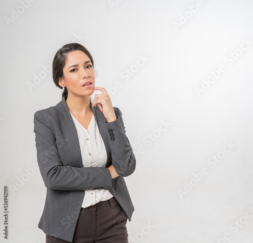 Studio portrait photo of a young beautiful elegant Brazilian female businesswoman lady wearing smart casual business attire suit posing with a series moments of emotion and gesture for all application