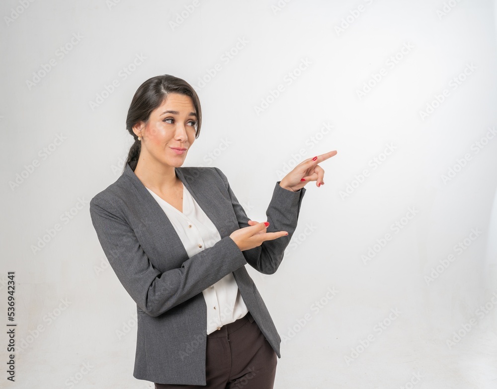 Studio portrait photo of a young beautiful elegant Brazilian female businesswoman lady wearing smart casual business attire suit posing with a series moments of emotion and gesture for all application Studio portrait photo of a young beautiful elegant Brazilian female businesswoman lady wearing smart casual business attire suit posing with a series moments of emotion and gesture for all application