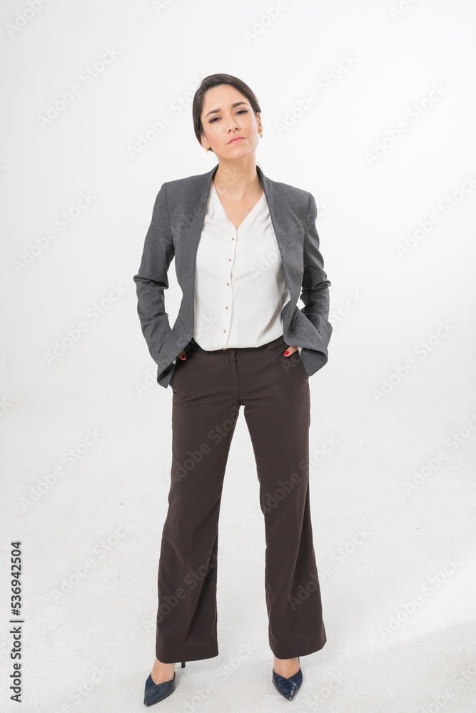 Studio portrait photo of a young beautiful elegant Brazilian female businesswoman lady wearing smart casual business attire suit posing with a series moments of emotion and gesture for all application Studio portrait photo of a young beautiful elegant Brazilian female businesswoman lady wearing smart casual business attire suit posing with a series moments of emotion and gesture for all application