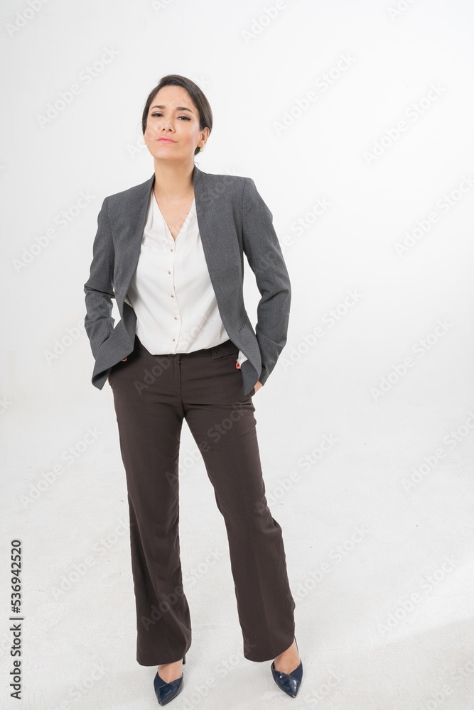 Studio portrait photo of a young beautiful elegant Brazilian female businesswoman lady wearing smart casual business attire suit posing with a series moments of emotion and gesture for all application Studio portrait photo of a young beautiful elegant Brazilian female businesswoman lady wearing smart casual business attire suit posing with a series moments of emotion and gesture for all application