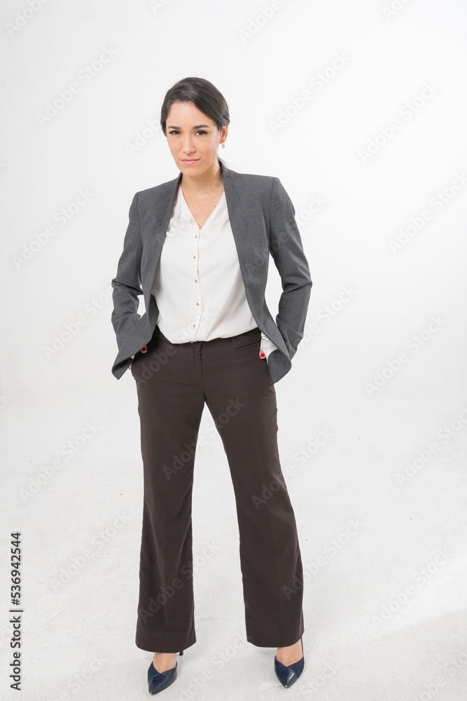 Studio portrait photo of a young beautiful elegant Brazilian female businesswoman lady wearing smart casual business attire suit posing with a series moments of emotion and gesture for all application Studio portrait photo of a young beautiful elegant Brazilian female businesswoman lady wearing smart casual business attire suit posing with a series moments of emotion and gesture for all application
