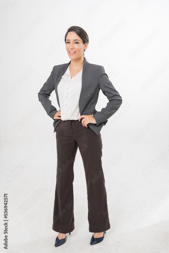 Studio portrait photo of a young beautiful elegant Brazilian female businesswoman lady wearing smart casual business attire suit posing with a series moments of emotion and gesture for all application Studio portrait photo of a young beautiful elegant Brazilian female businesswoman lady wearing smart casual business attire suit posing with a series moments of emotion and gesture for all application