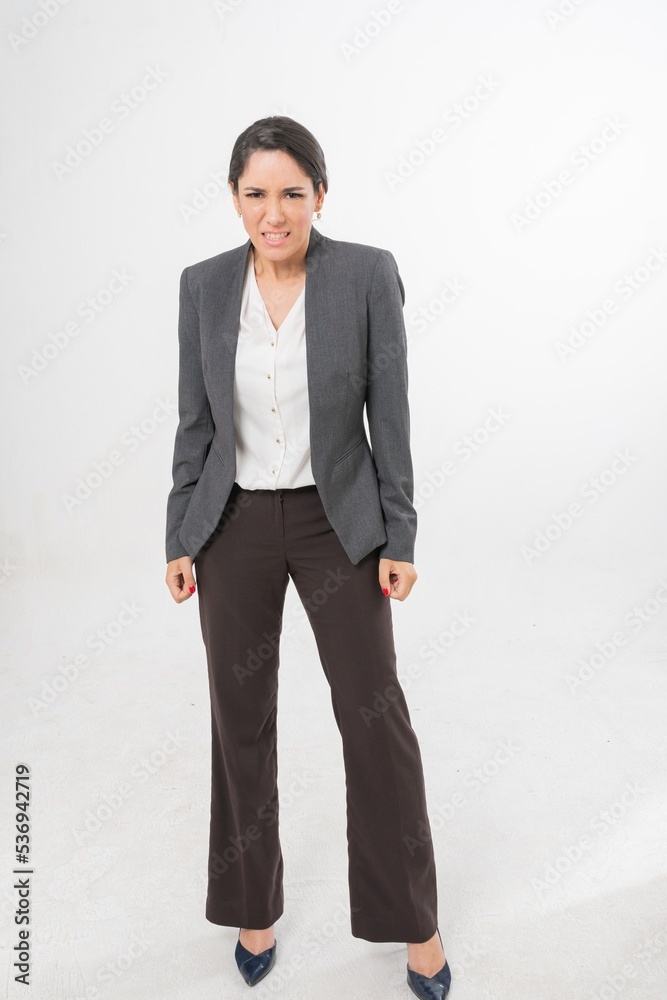 Studio portrait photo of a young beautiful elegant Brazilian female businesswoman lady wearing smart casual business attire suit posing with a series moments of emotion and gesture for all application Studio portrait photo of a young beautiful elegant Brazilian female businesswoman lady wearing smart casual business attire suit posing with a series moments of emotion and gesture for all application