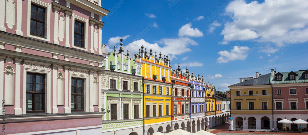 Panorama of the market square with historic houses in colorful Zamosc, Poland
