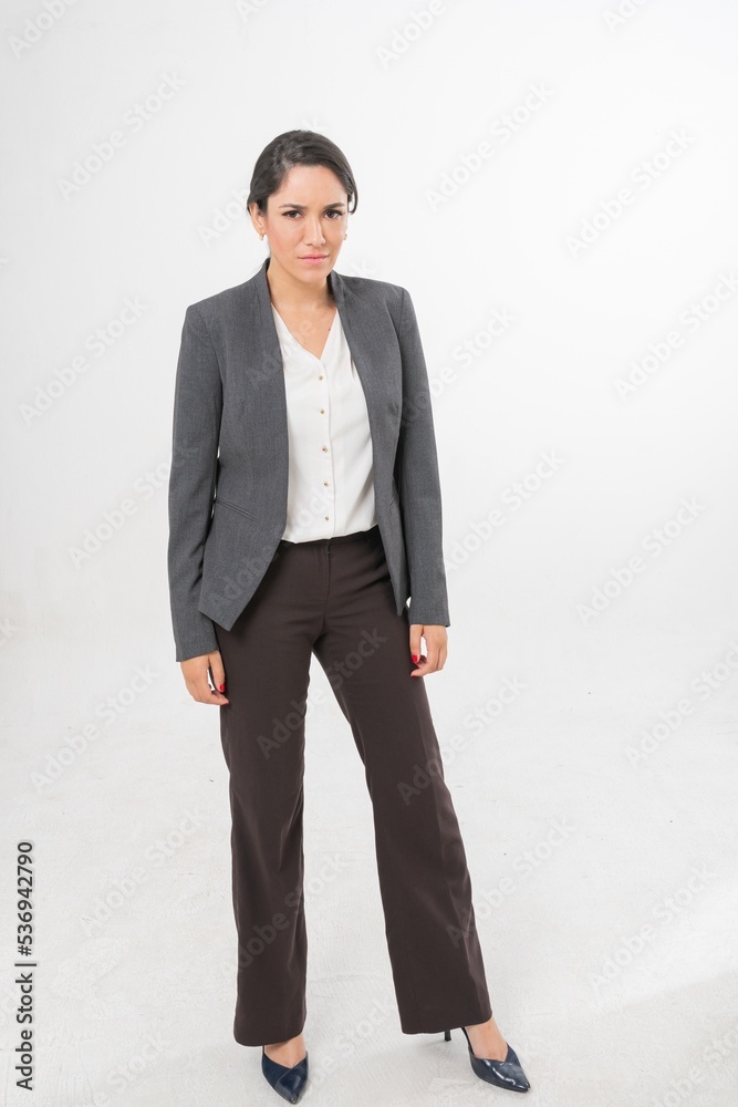 Studio portrait photo of a young beautiful elegant Brazilian female businesswoman lady wearing smart casual business attire suit posing with a series moments of emotion and gesture for all application Studio portrait photo of a young beautiful elegant Brazilian female businesswoman lady wearing smart casual business attire suit posing with a series moments of emotion and gesture for all application